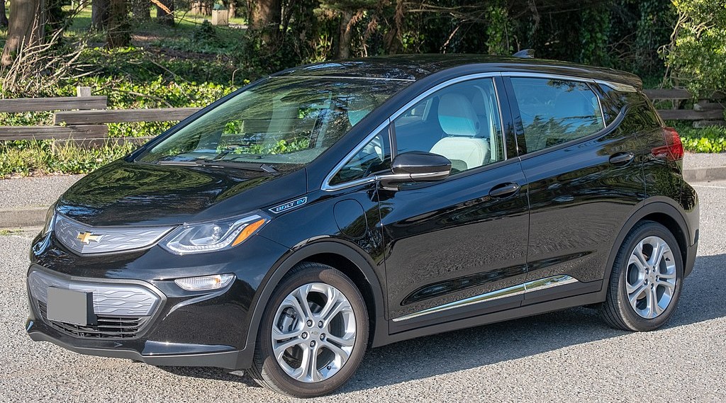 Black Chevy Bolt in nature